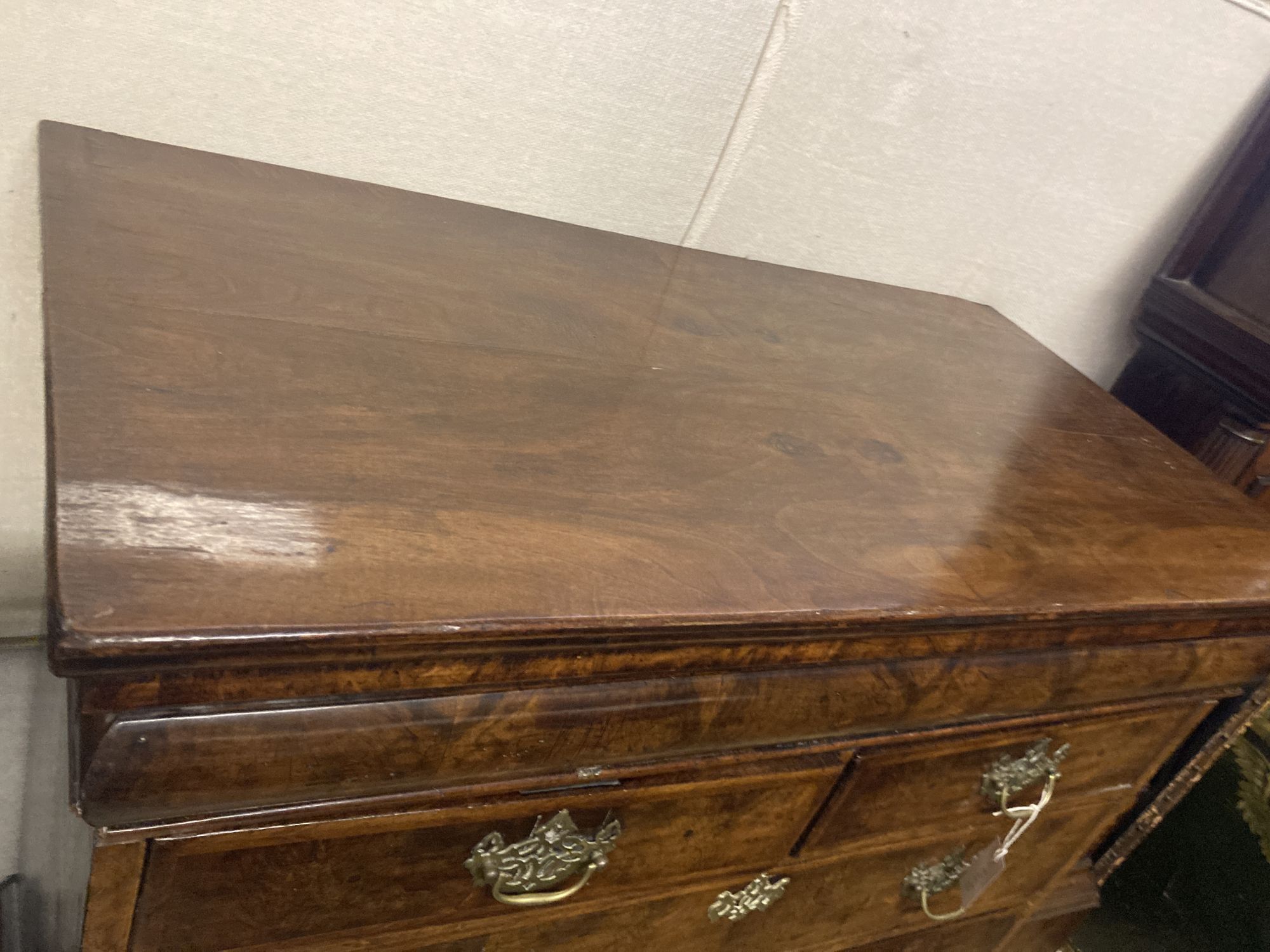 A mid 18th century walnut chest on stand, width 110cm depth 58cm height 142cm